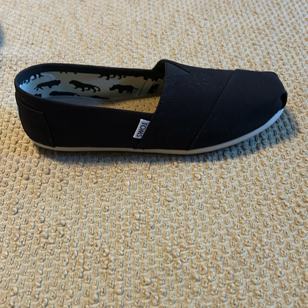 Tom’s canvas shoe.